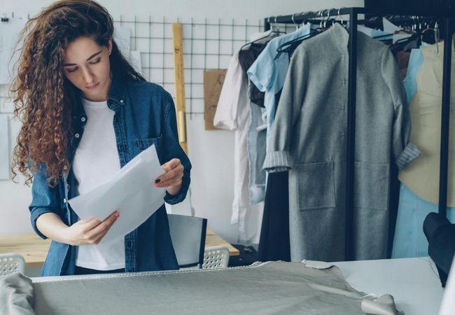 Fashion designer selecting garment trims